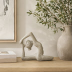 Design Republique Zen Yoga Décor in cream displayed on a light wood console beside neutral books, framed artwork and a textured vase.