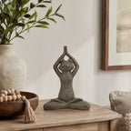 Design Republique Frog Yoga Décor in brown displayed in a neutral living room setting with its hands raised above its head.