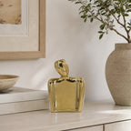 Design Republique Gold Body Abstract Statue Vase Small displayed on a light wood console with neutral décor and greenery.