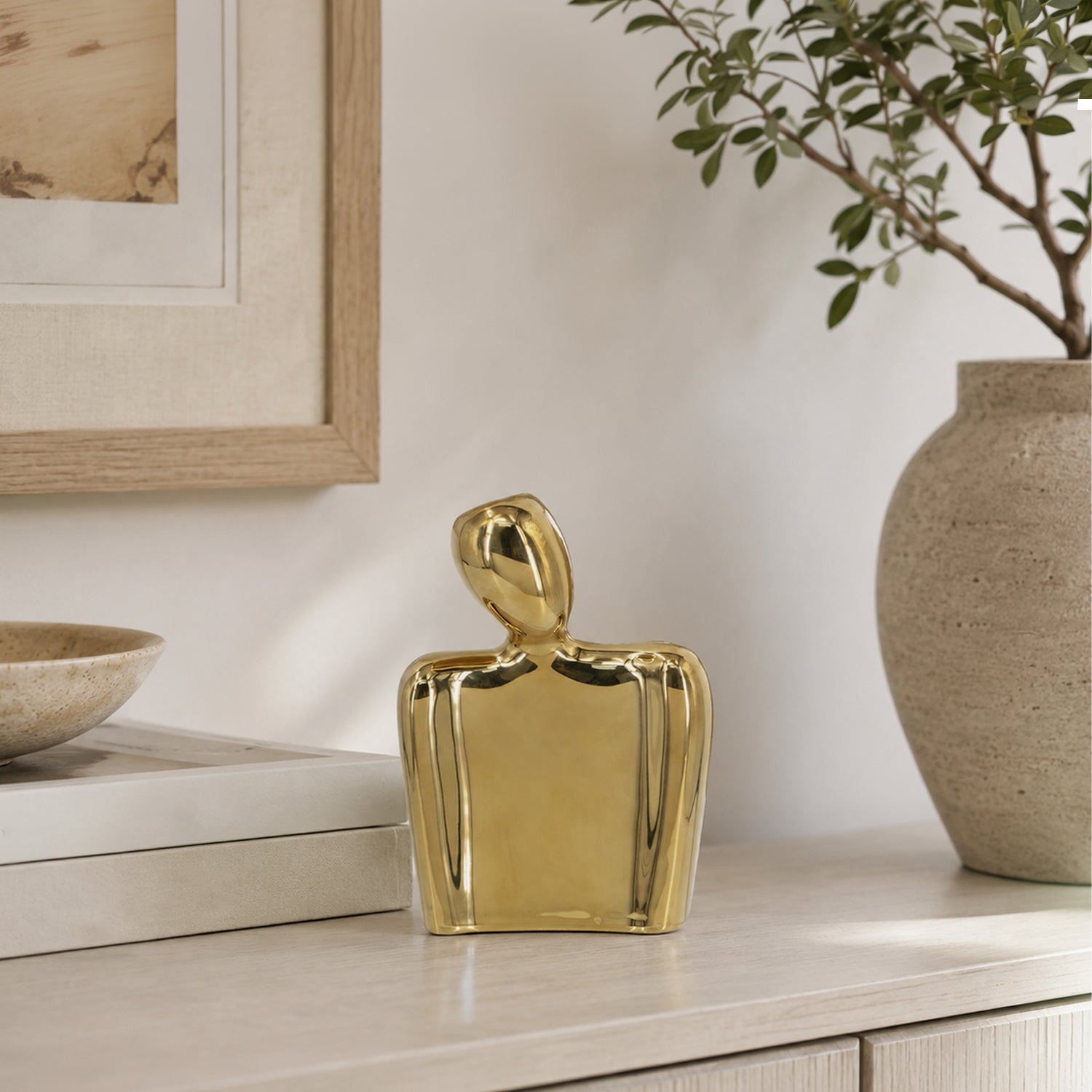 Design Republique Gold Body Abstract Statue Vase Small displayed on a light wood console with neutral décor and greenery.