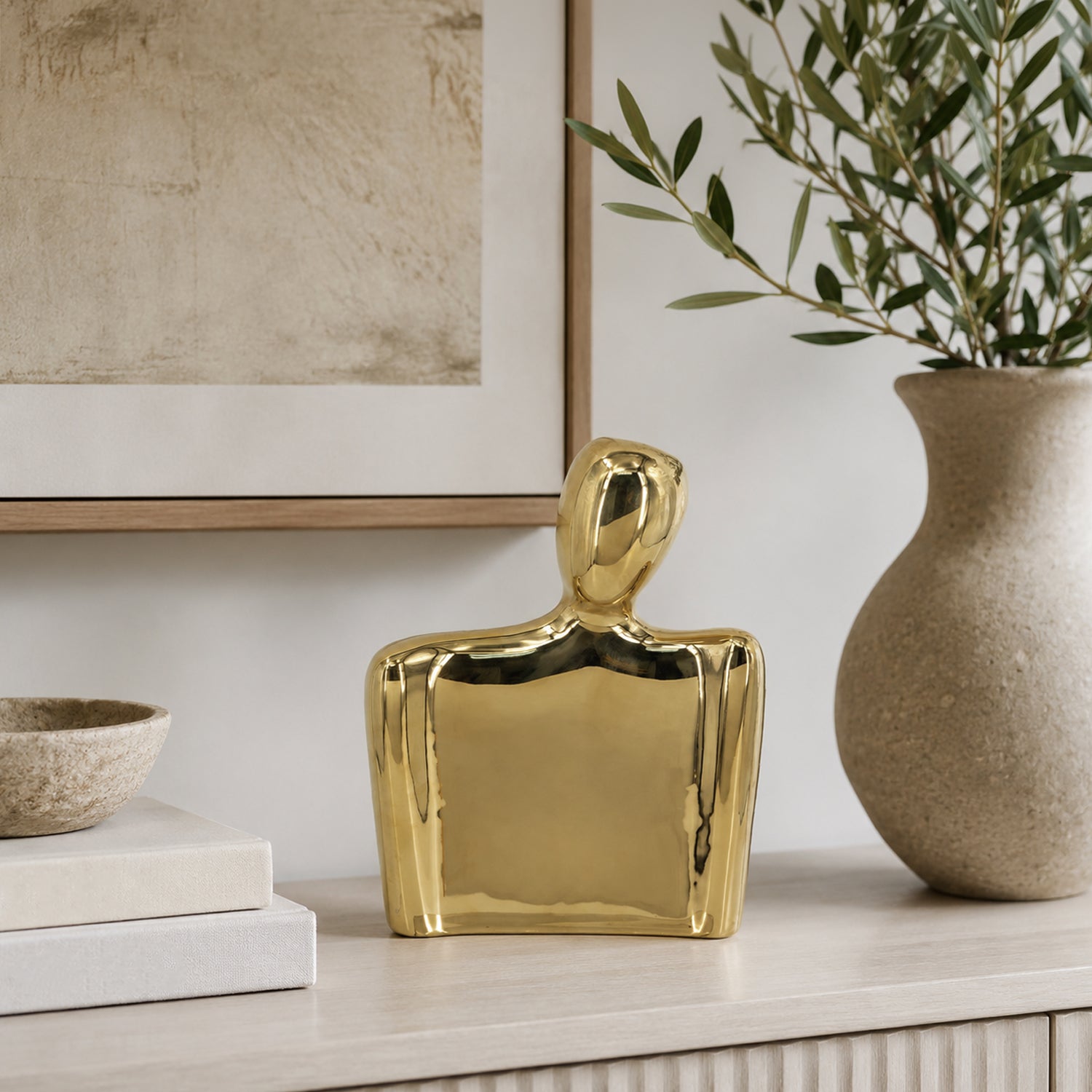 Design Republique Gold Body Abstract Statue Vase Large displayed on a light wood console with neutral books, framed artwork and a textured vase.