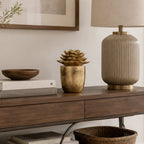 Design Republique Succulent Figurine Décor in gold displayed on a wooden console beside books and a table lamp.