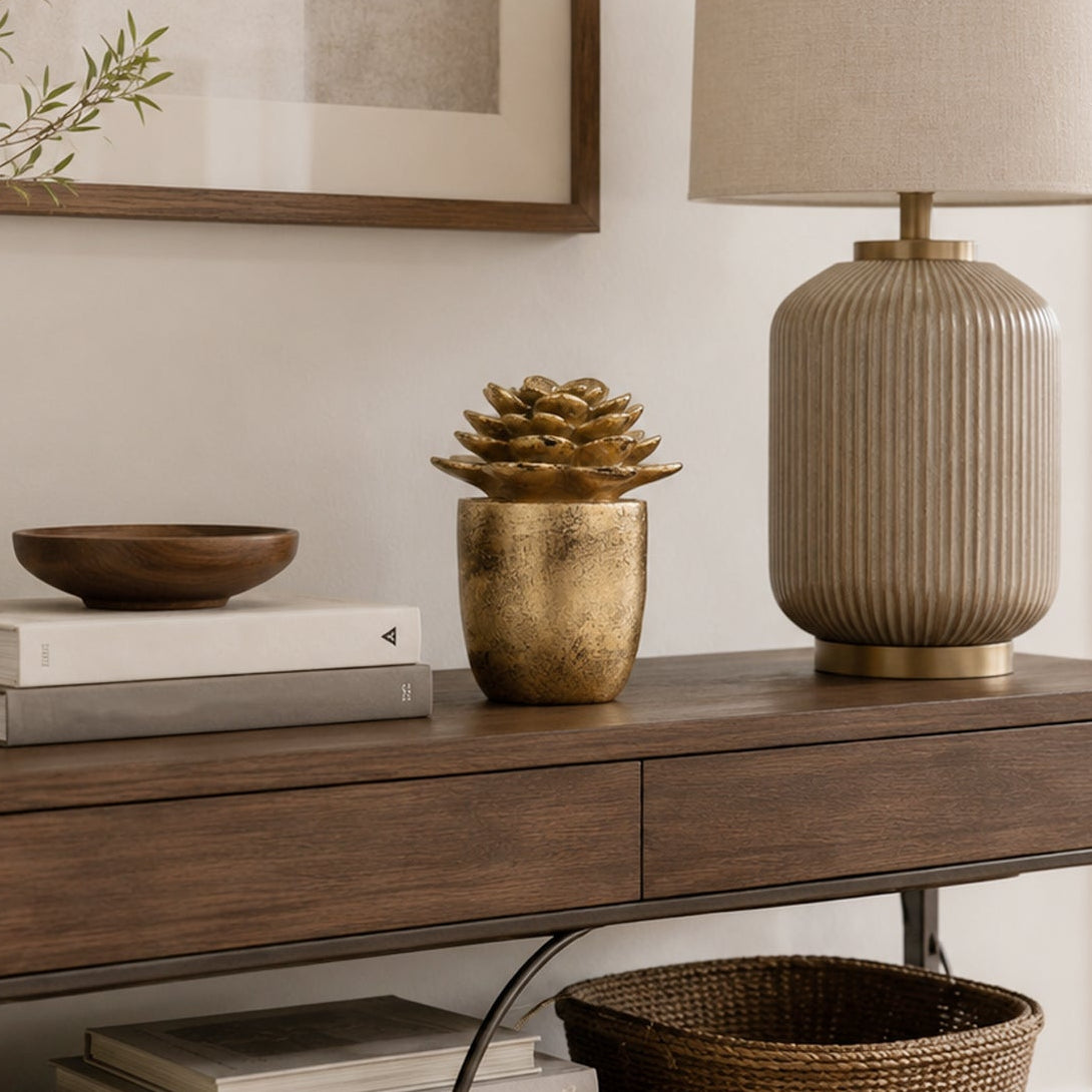 Design Republique Succulent Figurine Décor in gold displayed on a wooden console beside books and a table lamp.