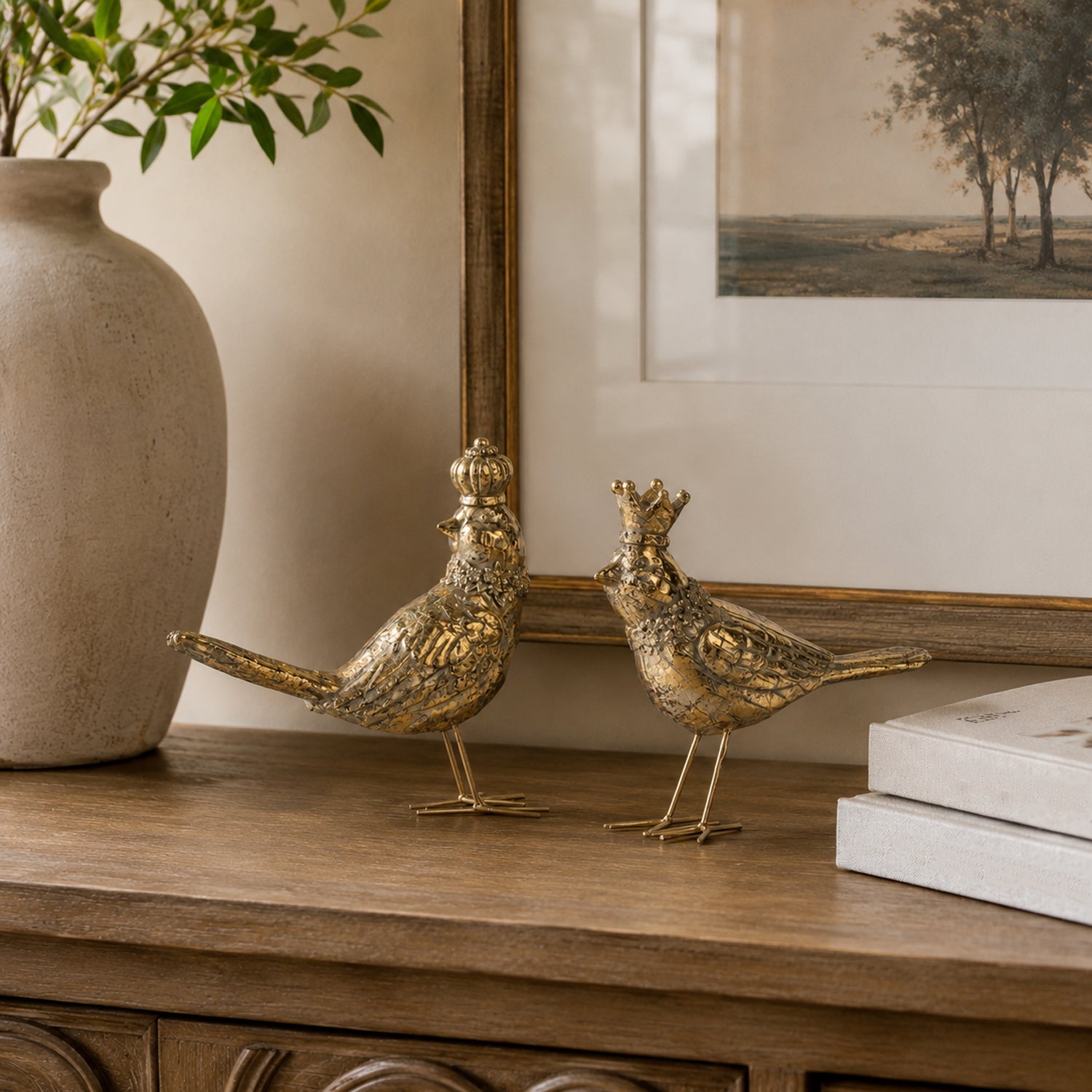 Design Republique Bird Accents in gold featuring two crowned birds displayed together on a wooden console.