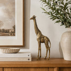 Design Republique Giraffe Decor Large in gold, styled on a console with neutral home décor.