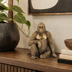 Design Republique Gorilla Decor in gold, styled on a console table with neutral décor and greenery.
