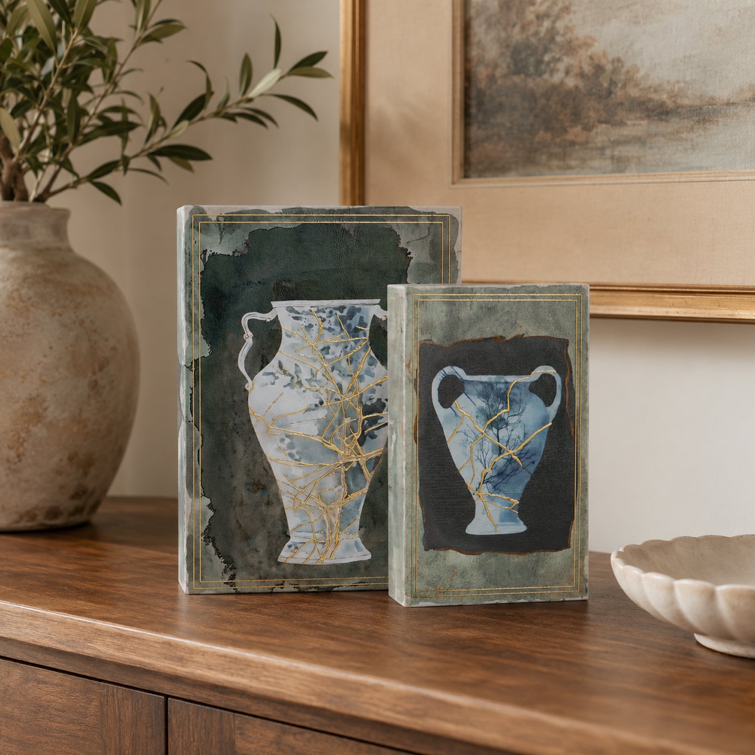 Gracious Living Franco Book Box Set of 2 in blue, styled on a wooden console with decorative vase artwork and gold detailing.