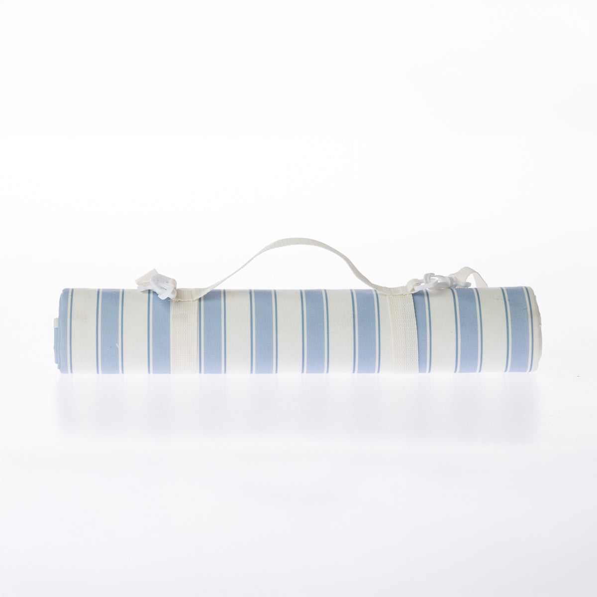 A rolled-up picnic mat on a white background.