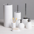 A coordinated white bathroom accessories collection, including a toilet roll holder, toilet brush, soap dispensers, toothbrush holder, and soap dish, brings a clean, modern look to any bathroom.