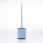 A denim blue toilet brush with a matching cylindrical holder and black base, shown on a clean white background.