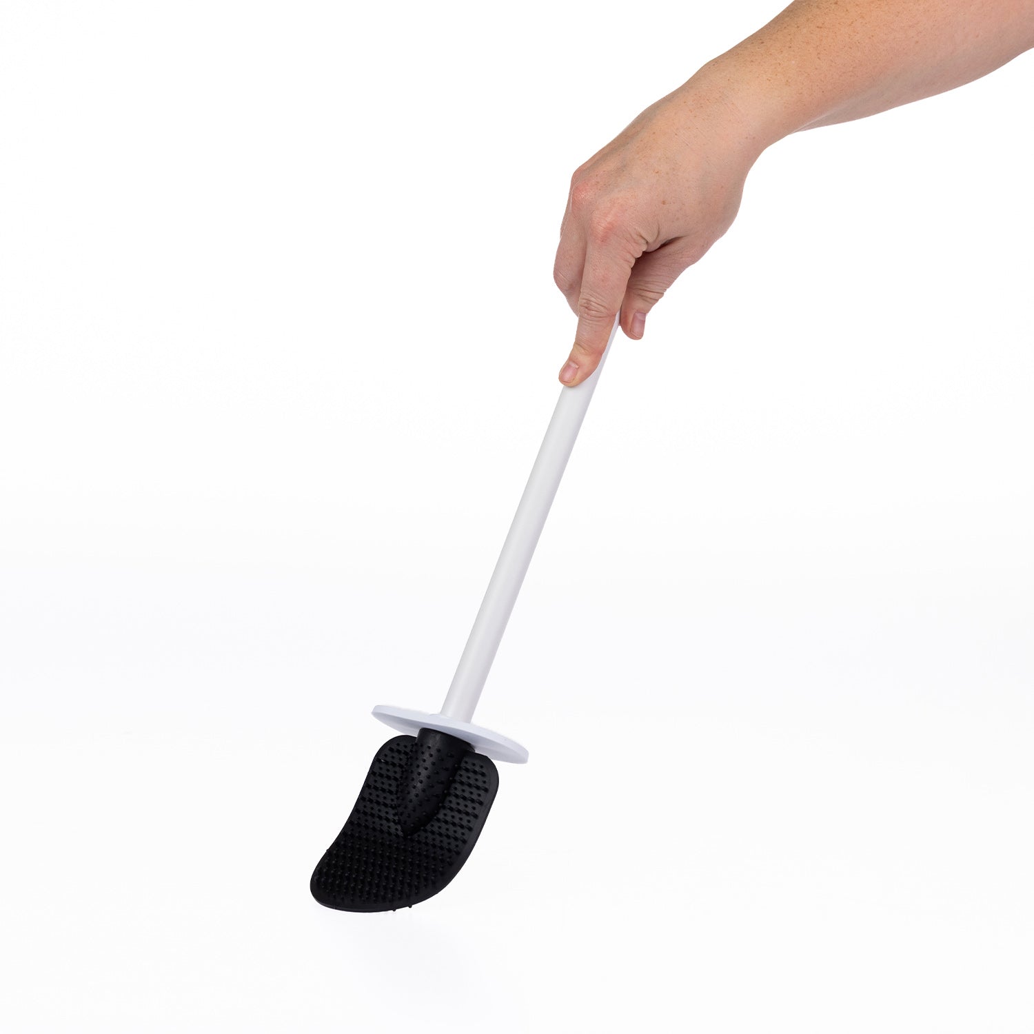 A hand holding a long-handled cleaning toilet brush with a black textured scrubber head and a white handle, shown against a plain white background.