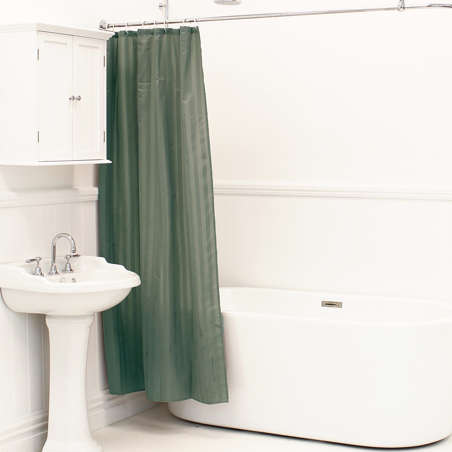 Charcoal shower curtain hanging beside a white bathtub and pedestal sink in a bright bathroom.
