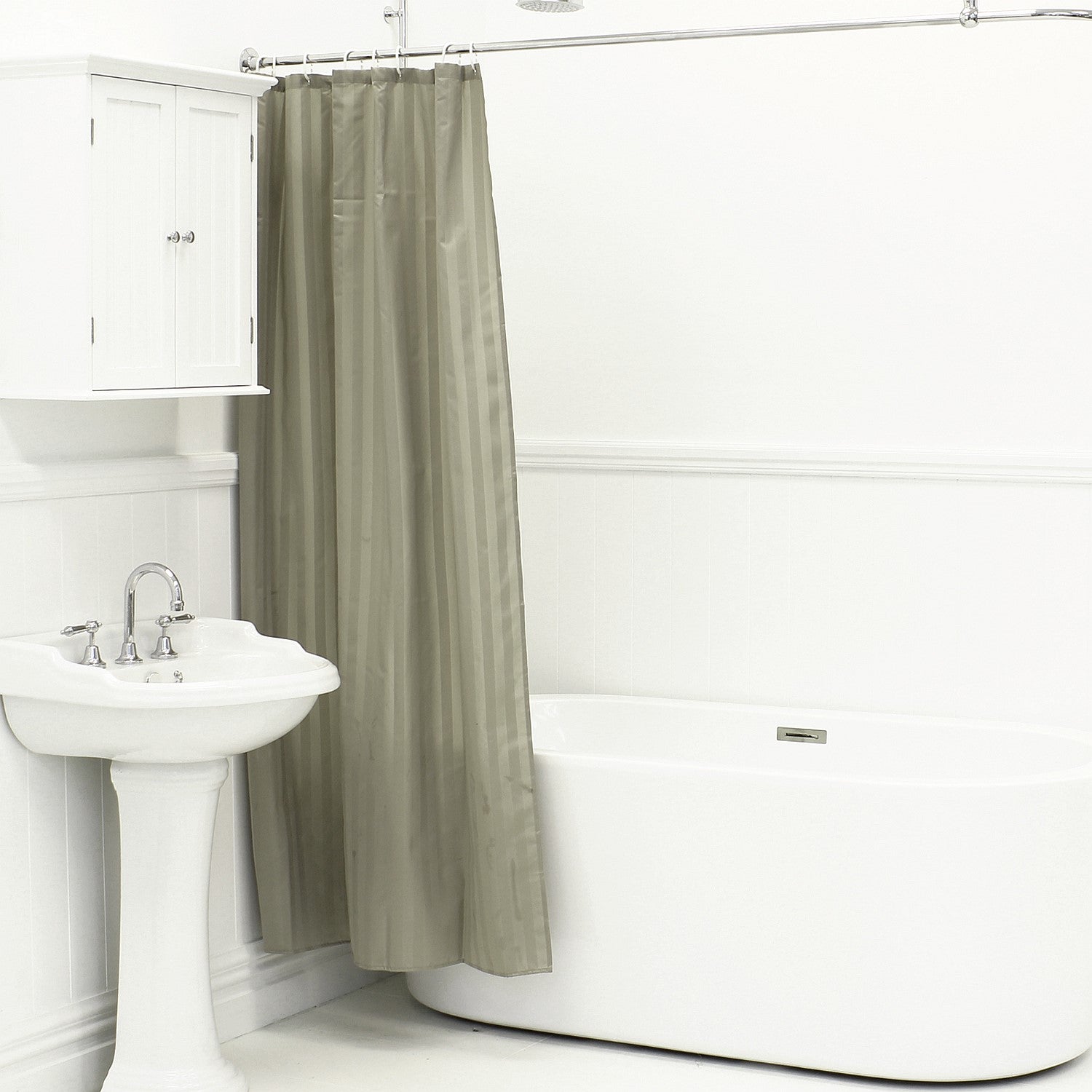 Mushroom shower curtain hanging beside a white bathtub and pedestal sink in a bright bathroom.