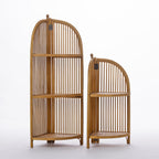 Two natural wood corner shelving units in coordinating tall and short sizes feature elegant arched slatted designs and woven shelves, offering timeless style for displaying décor in compact spaces.