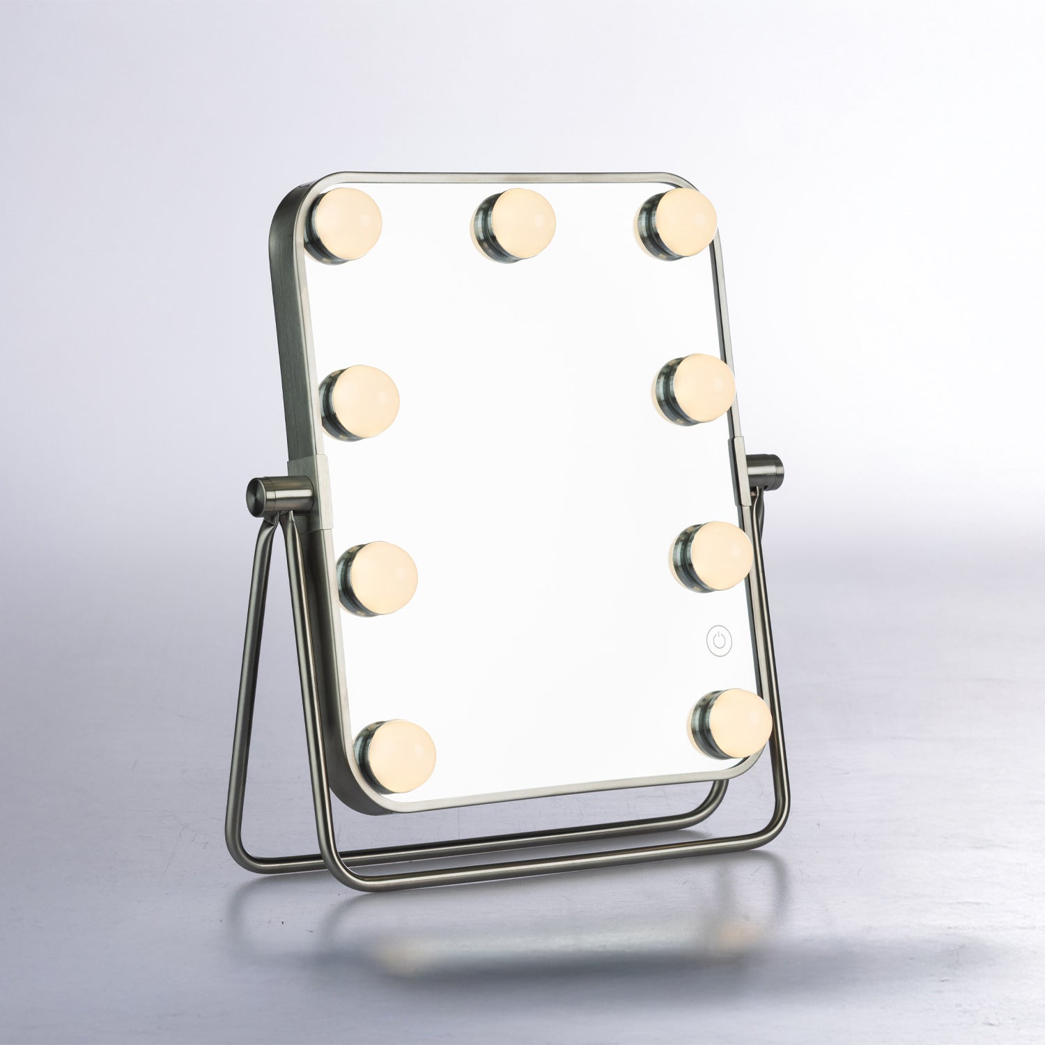 LED tabletop vanity mirror with illuminated globe lights, silver frame and adjustable stand.