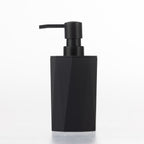 Home Essentials Gabriel Origami black soap dispenser with a matte black pump and natural bamboo accent.
