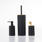 Home Essentials Gabriel Origami black bathroom accessories set including a soap dispenser, toilet brush holder and toothbrush holder with bamboo accents.