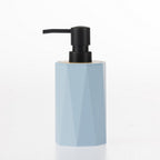 Home Essentials Gabriel Origami blue soap dispenser with a matte black pump and natural bamboo accent.