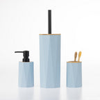 Home Essentials Gabriel Origami blue bathroom accessories set including a soap dispenser, toilet brush holder and toothbrush holder with bamboo accents.