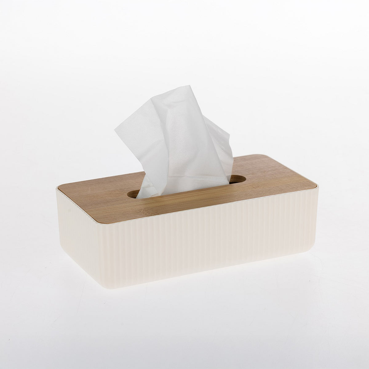 White ribbed tissue box holder with a natural bamboo lid and white tissues for a modern bathroom or living space.