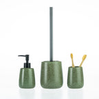 Green speckled bathroom accessories set including a soap dispenser, toilet brush holder, and tumbler with toothbrushes.
