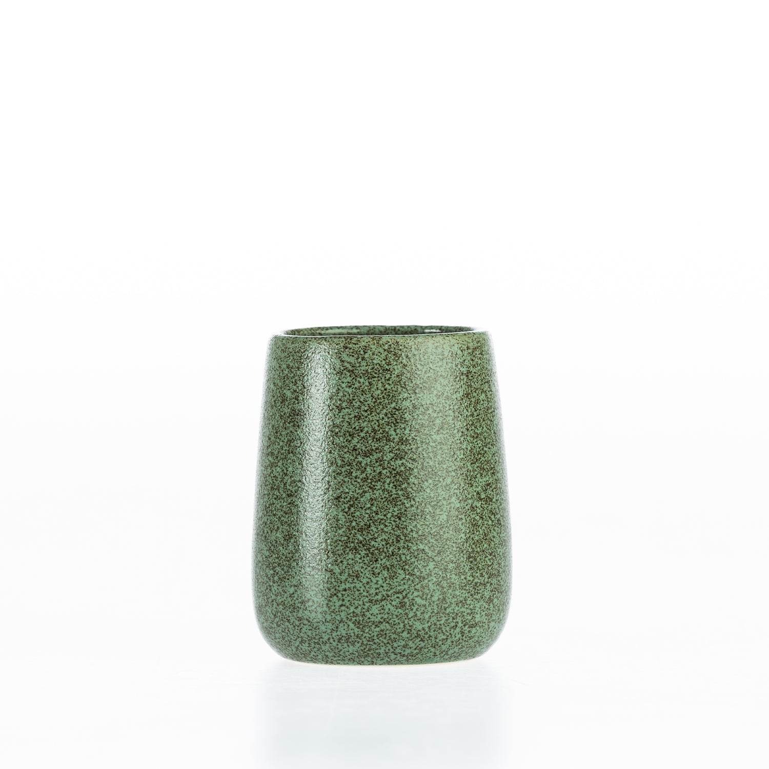Green speckled bathroom tumbler with a rounded stoneware-style design, ideal for holding toothbrushes and bathroom essentials.
