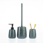 Charcoal speckled bathroom accessories set including a soap dispenser, toilet brush holder, and tumbler with toothbrushes.
