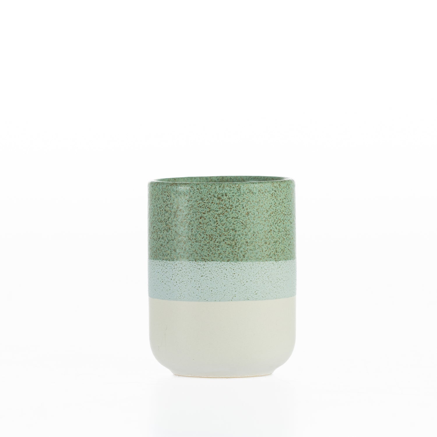 Design Republique Kaikoura Fade tumbler in stoneware with a speckled reactive glaze and layered green and cream finish, ideal for holding toothbrushes and bathroom essentials.
