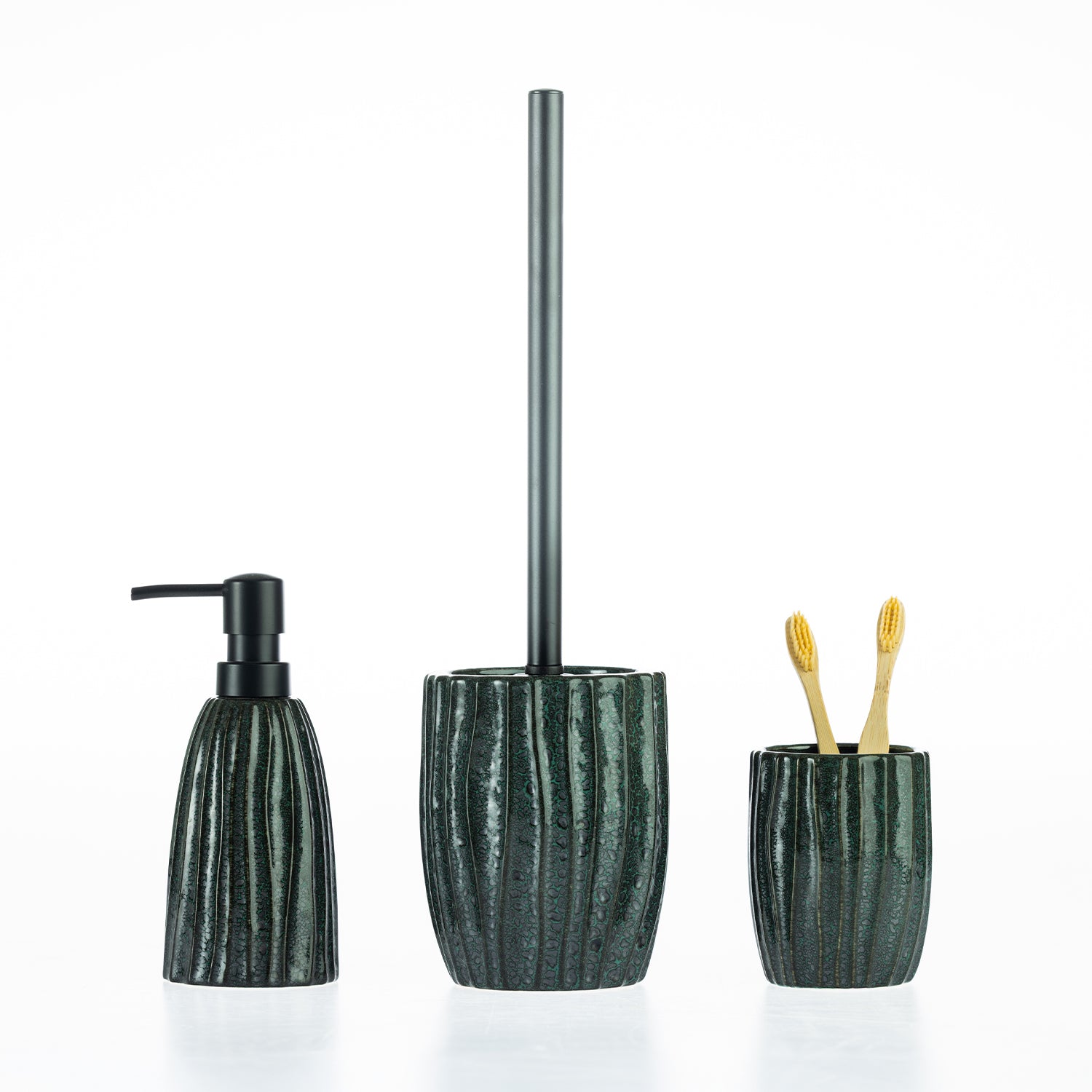 Fieldcrest Aoraki bathroom accessories collection featuring a matching soap dispenser, toilet brush holder, and tumbler in a textured ribbed stoneware design with a glossy glazed finish.