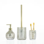 Coordinated Design Republique Raya Gold Glass bathroom accessory set including a soap dispenser, toilet brush holder, and tumbler with matching ribbed glass and gold accents.