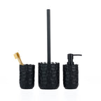A coordinated black bathroom accessory set featuring textured stoneware designs, including a toothbrush holder, toilet brush holder and soap dispenser.