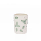 Ceramic Gracious Living Irina Floral Toothbrush Holder in Ivory with a soft green floral pattern, holding two natural bamboo toothbrushes.