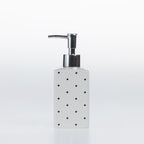 Design Republique Spotty Ceramic Soap Dispenser in White with black dot detailing and a chrome-look pump.