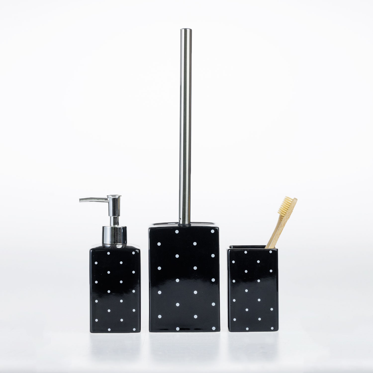 Design Republique Spotty Ceramic Bathroom Accessories in Black, featuring a coordinating soap dispenser, toilet brush holder and tumbler with white spot detailing.