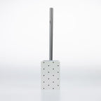 Design Republique Spotty Ceramic Toilet Brush Holder in White with black dot detailing and a chrome-look handle.