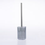 A modern toilet brush with a brushed silver metal handle and a translucent smoky gray acrylic holder, shown on a seamless white background.