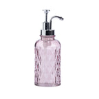 A pink textured glass soap dispenser with a shiny silver metal pump, shown against a plain white background.