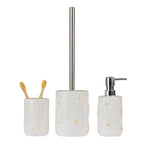 Marlo Daisy Bathroom Collection in Ivory, featuring a matching ceramic tumbler, toilet brush holder and soap dispenser with raised white daisy flowers, yellow centres and silver fittings.