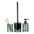 Design Republique Ginny bathroom accessories in green textured glass, featuring a toothbrush holder, toilet brush holder and soap dispenser with black fittings against a white background.
