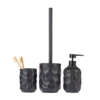 Design Republique Neva bathroom accessories in Black, including a tumbler, toilet brush holder and soap dispenser with a textured faceted finish.