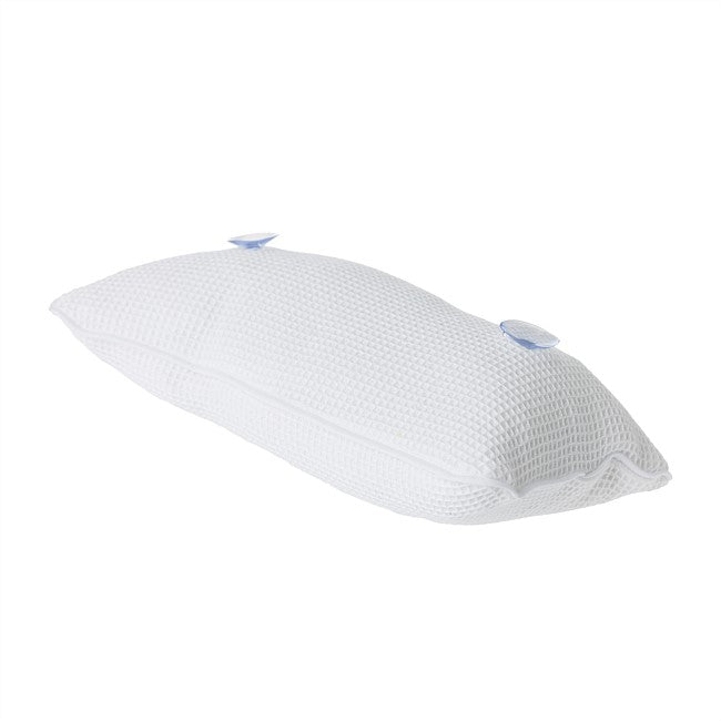 A white textured cervical pillow with two small blue valve caps on top, shown on a plain white background.