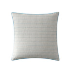 A European pillow in a light beige cotton fabric with thin horizontal blue stripes and a matching blue piped edge, shown on a solid white background.