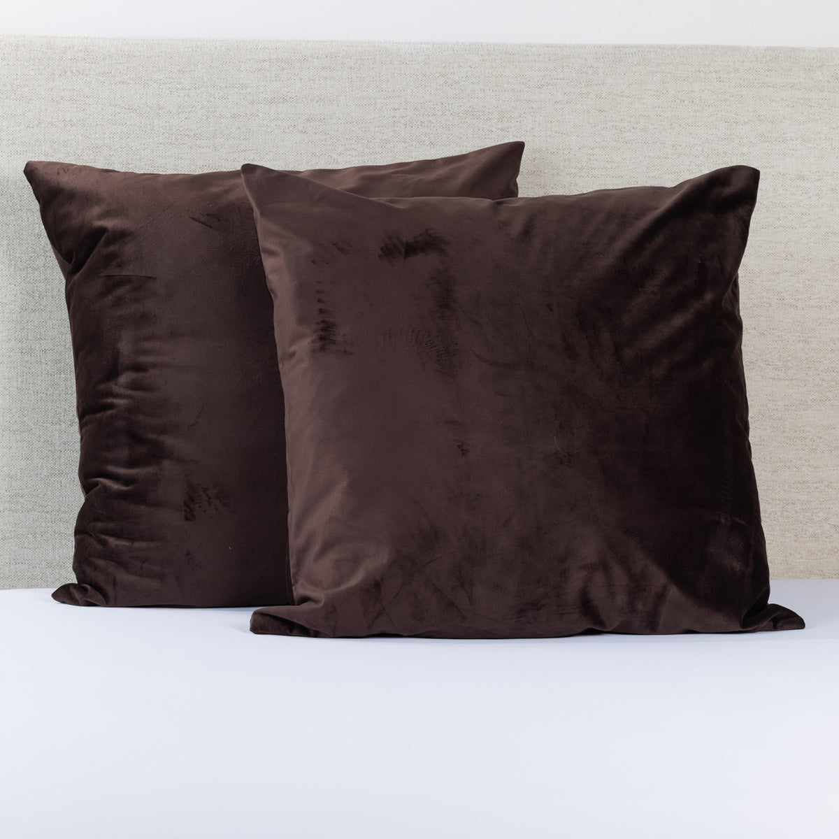 Design Republique Velvet Euro Pillowcase Pair in Chocolate, featuring two rich dark brown velvet pillowcases with a soft plush finish, styled against a neutral upholstered headboard.