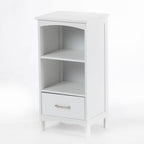 A white bathroom storage unit with two open shelves, a lower drawer, and a clean, classic design offers practical storage with a timeless look.