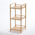 A freestanding three-tier bamboo shelving unit with open slatted shelves offers a compact and stylish storage solution for bathrooms, kitchens, or living spaces.
