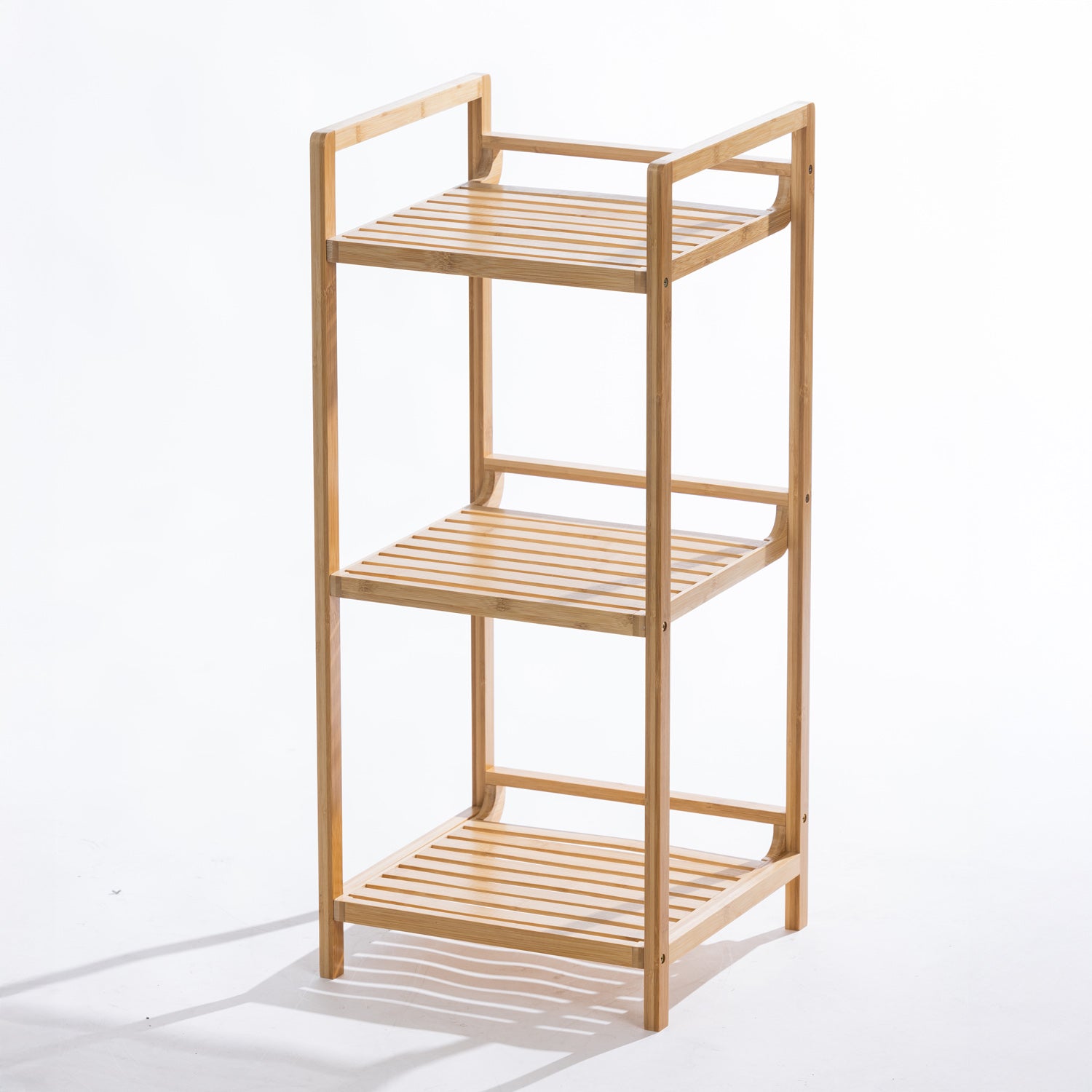A freestanding three-tier bamboo shelving unit with open slatted shelves offers a compact and stylish storage solution for bathrooms, kitchens, or living spaces.