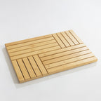 Bamboo bath mat featuring a modern slatted geometric design on a clean white background.