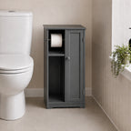 Grey toilet roll holder and cabinet with open shelving and enclosed cupboard placed beside a white toilet in a bathroom.