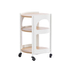 Rear angled view of the Solace Parker 3 Tier Trolley in white and natural, showing the curved side panels, three shelves and caster wheels.