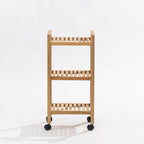 A three-tier wooden rolling shelf cart with black caster wheels, photographed against a clean white studio background.